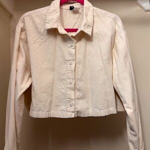 Cream buttoned up top